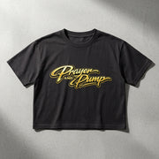 Black t-shirt with 'Prayer and Pump' text in gold on a gray background