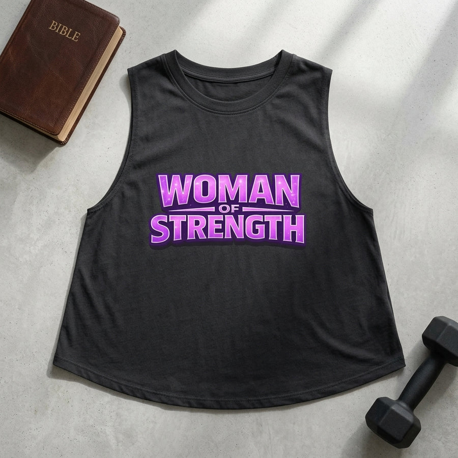Black tank top with 'Woman of Strength' text on a gray surface with a Bible and dumbbell.